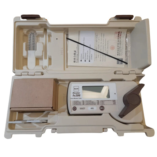 Measurement device with digital display in an open beige case on a white background